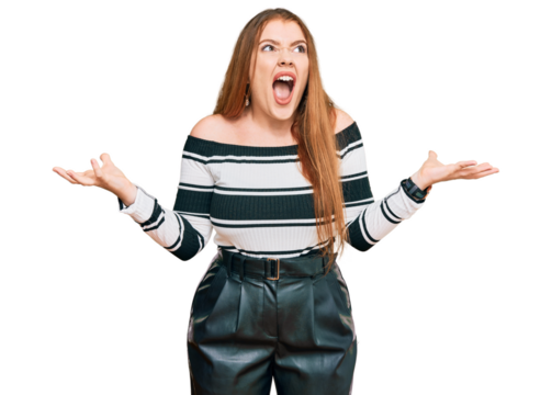 Young beautiful redhead woman wearing elegant clothes crazy and mad shouting and yelling with aggressive expression and arms raised. frustration concept.