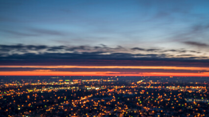 abstract landscape - defocused city lights before sunrise in northern Colorado