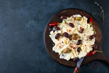 Homemade Trendy Butter Board with Herbs and Bread. Butter board with herbs and olives. Trendy food. Trendy appetizer