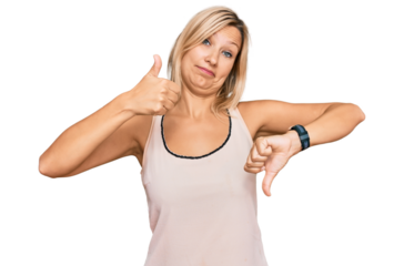 Middle age caucasian woman wearing casual clothes doing thumbs up and down, disagreement and agreement expression. crazy conflict
