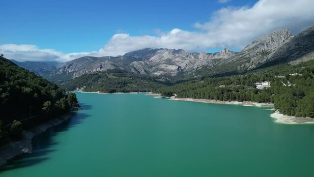 Aerial view of reservoir Guadalest beautiful landscape with green blue water in El Castell de Guadalest, Alicante, Valencia, Spain.