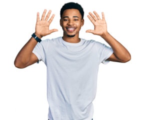 Young african american man wearing casual white t shirt showing and pointing up with fingers number ten while smiling confident and happy.