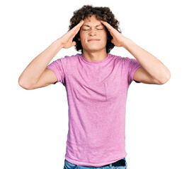 Caucasian teenager wearing casual clothes with hand on head, headache because stress. suffering migraine.