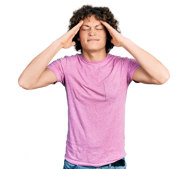 Caucasian teenager wearing casual clothes with hand on head, headache because stress. suffering migraine.