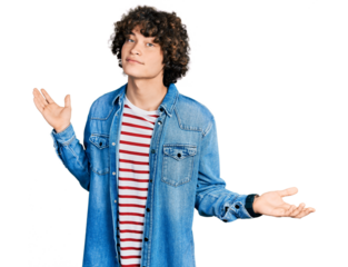 Caucasian teenager wearing casual clothes clueless and confused expression with arms and hands raised. doubt concept.