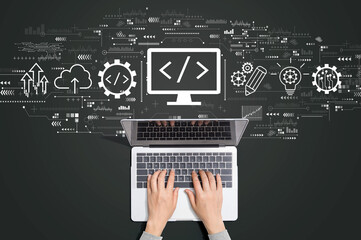 Fototapeta na wymiar Web development concept with person using a laptop computer