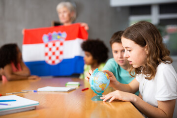 Kids learning together about croatia in geography class