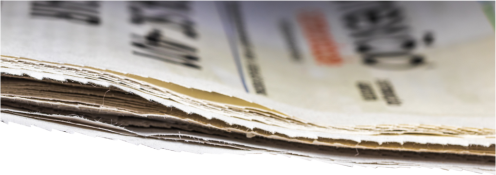 Closeup of newspaper with blur. Transparent background.