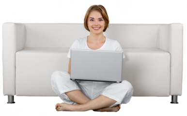 Portrait of a Woman Using her Laptop while Sitting on the Floor