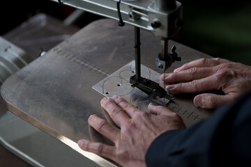 Work cutting aluminum with a scroll saw
