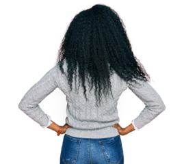 Middle age african american woman wearing casual clothes standing backwards looking away with arms on body