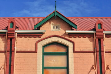 Orange-red-yellow-green Federation style building at The Corso pedestrian mall-Manly suburb. Sydney-Australia-523