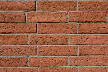 Brick wall red orange brown color in sunlight