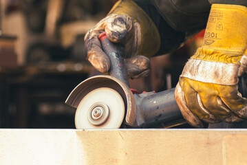 cutting metal with an angle grinder,wood, worker, carpenter, work, construction, tool, working, diy, home, equipment, craftsman, job, people, tools, hand, repair, person, woman, building, carpentry, h