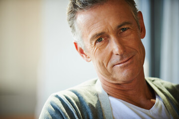 Rich in life experience. Cropped view of a handsome mature man looking at the camera.