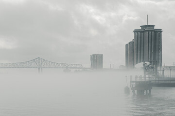 View of cityscape by river on a foggy morning in Luisiana