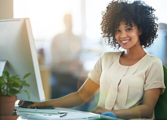 Theres no limit to my career. Portrait of a young designer working at her computer in an office.