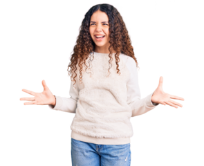 Beautiful kid girl with curly hair wearing casual clothes crazy and mad shouting and yelling with aggressive expression and arms raised. frustration concept.