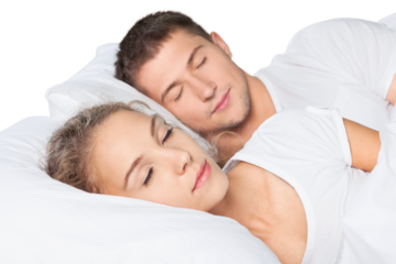 Young  couple sleeping on the bed in bedroom
