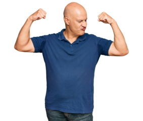 Middle age bald man wearing casual clothes showing arms muscles smiling proud. fitness concept.