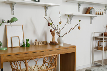 Vase with Easter decor on table in living room