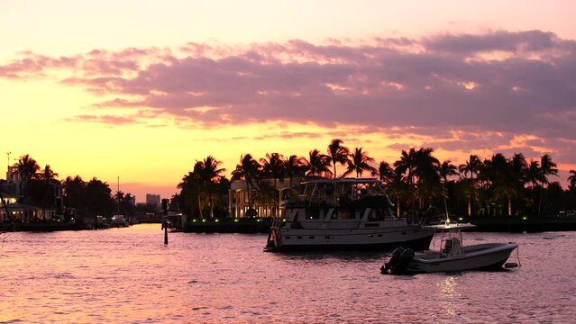 8k video beautiful tropical sunset in Florida. yachts and mansions palms