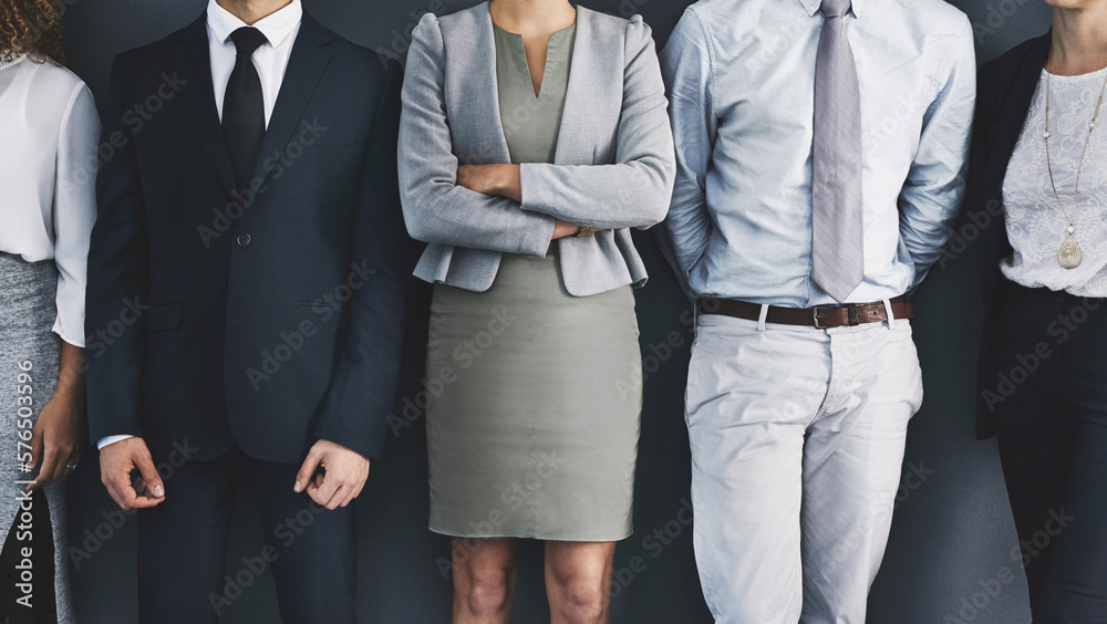 Poster in line for success. cropped studio shot of a group of businesspeople standing in line against a gra