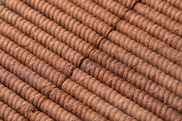 Delicious chocolate wafer rolls as background