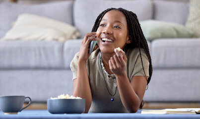 Lounge phone call or black woman with smile, connection or study break with popcorn. African...