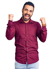Young hispanic man wearing casual clothes screaming proud, celebrating victory and success very...