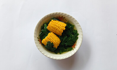 Sayur bening bayam or vegetable clear spinach or spinach soup with corn vegetables, Indonesian cuisine. Simple vegetable preparations rich in health benefits.