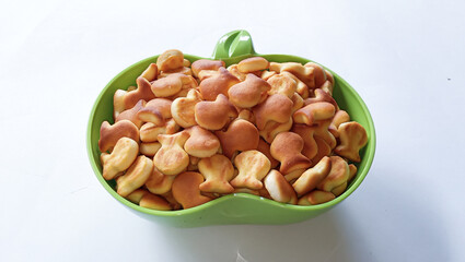 Healthy cookies made of flour in a bowl on a white background. Children's favorite healthy snacks.