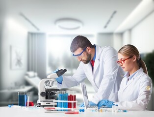 Young smart scientist working with microscope in the lab