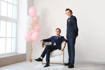 Teenage boys dressed for prom in room © Pixel-Shot