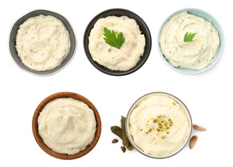 Set of bowls with tartar sauce on white background, top view