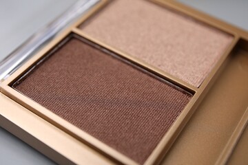 Beautiful eyeshadow palette as background, closeup. Professional cosmetic product