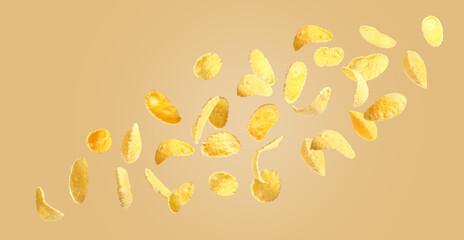 Many tasty corn flakes flying on pale orange background
