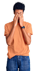 Young african american man wearing casual clothes rubbing eyes for fatigue and headache, sleepy and...