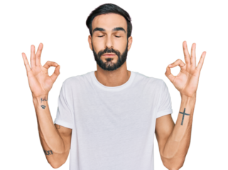 Young hispanic man wearing casual white t shirt relax and smiling with eyes closed doing meditation gesture with fingers. yoga concept.