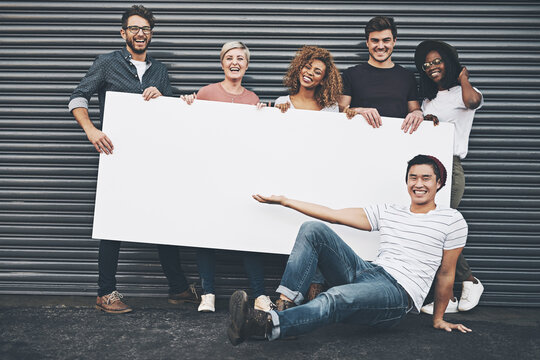 If You Want To Say Something, Say It Here. Shot Of A Diverse Group Of People Holding Up A Placard Outside.