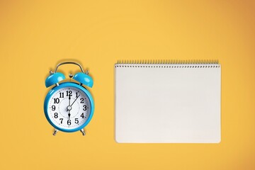 Blank office Calendar or Planner and alarm clock