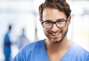 Obraz premium Here to help heal you. Portrait of a happy young man working as a surgeon in a hospital.