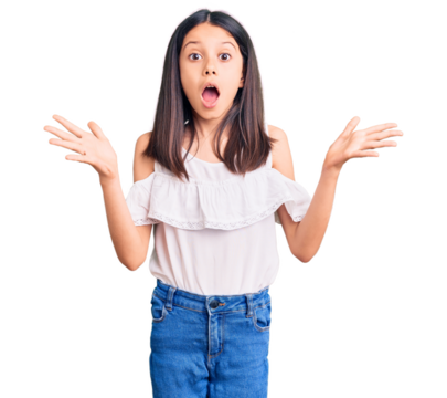 Beautiful child girl wearing casual clothes celebrating crazy and amazed for success with arms raised and open eyes screaming excited. winner concept