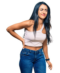 Fototapeta premium Beautiful hispanic woman wearing casual clothes suffering of backache, touching back with hand, muscular pain