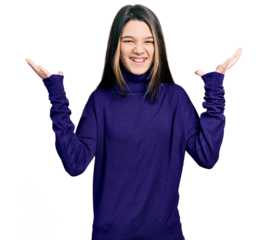 Young brunette girl with long hair wearing turtleneck sweater celebrating mad and crazy for success with arms raised and closed eyes screaming excited. winner concept