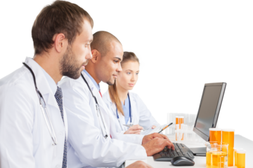 Portrait of Doctors Looking at Laptop and Writing on Clipboard