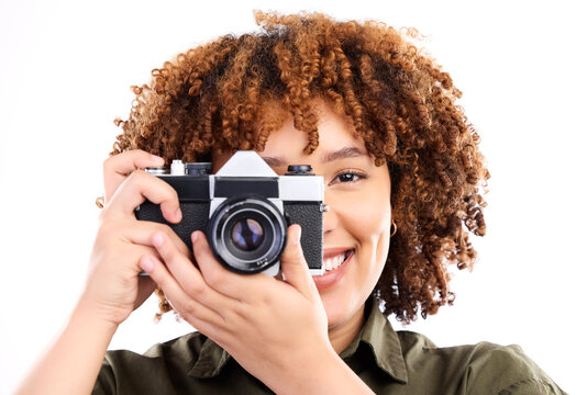 Camera, black woman and portrait of a young person taking a picture in a studio. Isolated, white background and photography shooting with a female feeling happiness with a smile from creativity