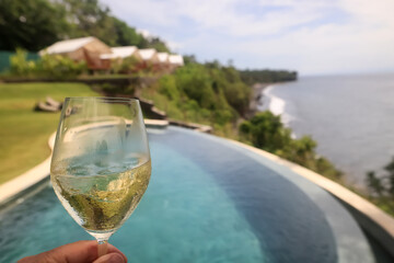 a glass of white wine in a restaurant, alcohol luxury background