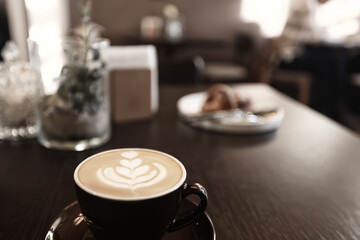 a cup of coffee in a cafe, photo morning coffee luvak cappuccino