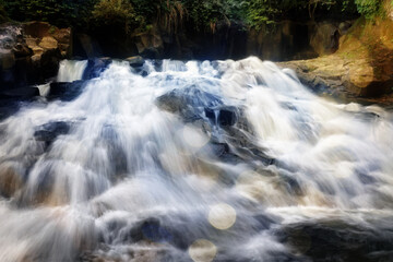 jet stream of water in a waterfall detal abstract background